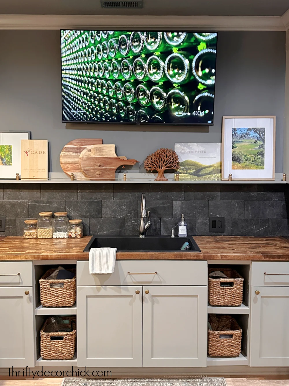 TV and shelf above bar sink
